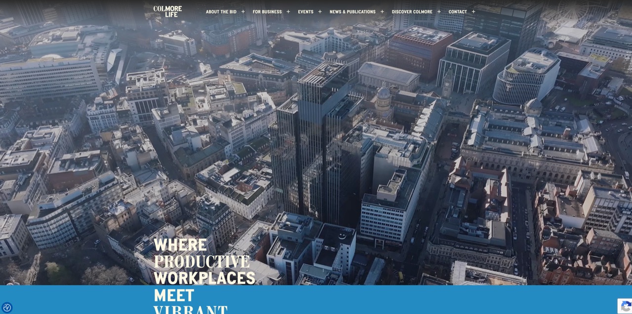 The Colmore Life homepage — an aerial photograph of Birmingham’s business district behind the headline ‘Where productive workplaces meet vibrant…’, with the COLMORE LIFE navigation across the top.
